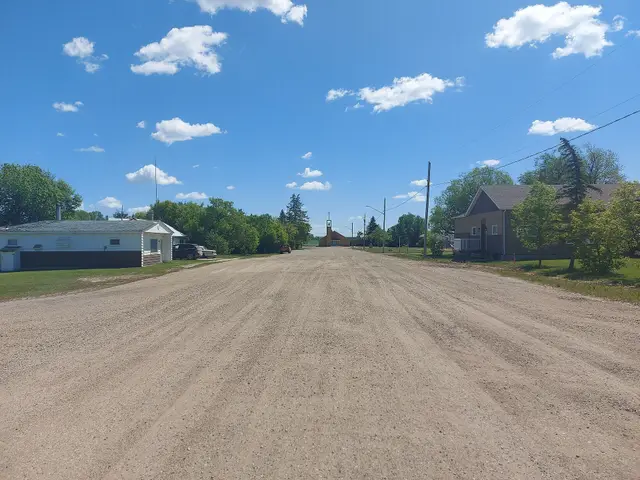 Gravel street looking toward the church